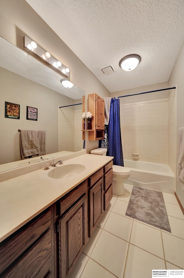 bathroom featuring tile patterned flooring, toilet, vanity, a textured ceiling, and shower / bath combination with curtain