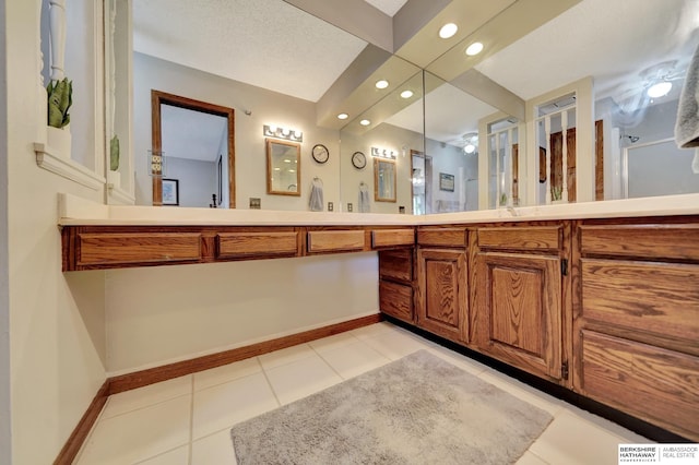 bathroom featuring recessed lighting, tile patterned flooring, baseboards, and vanity