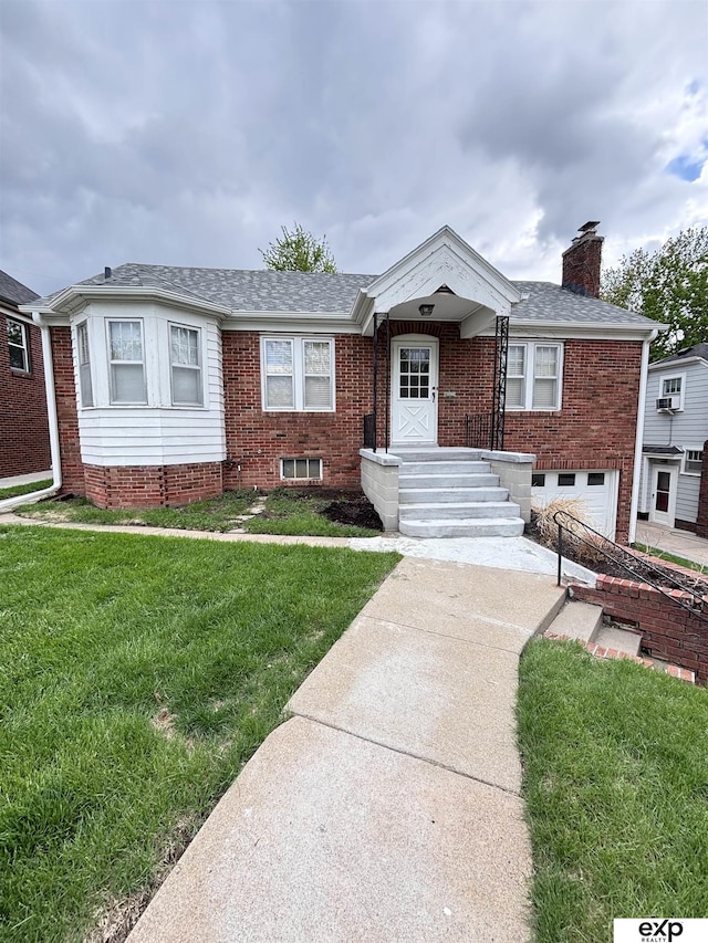 view of front of house featuring brick siding, a front yard, a chimney, an attached garage, and roof with shingles