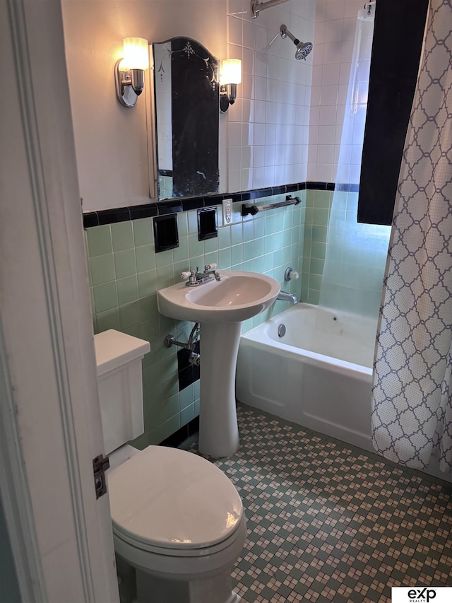 bathroom featuring tile walls, toilet, and shower / bath combo