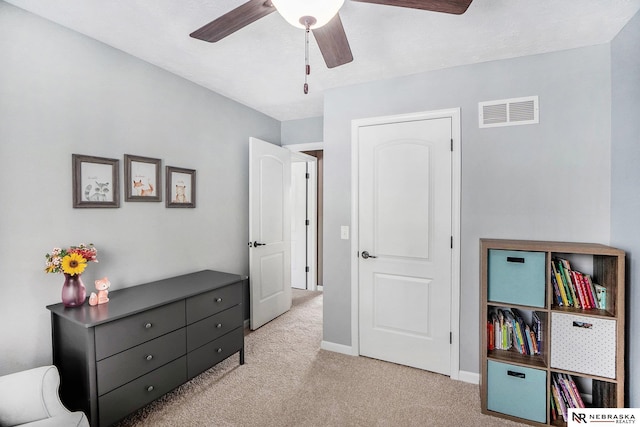 carpeted bedroom with baseboards and ceiling fan