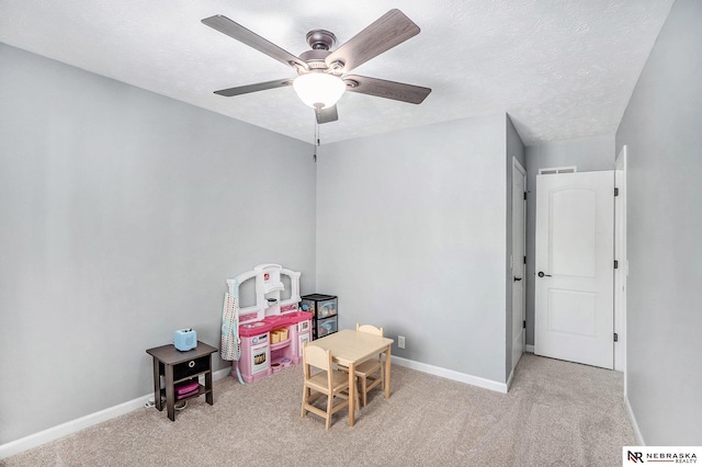 game room with baseboards, a ceiling fan, and carpet flooring