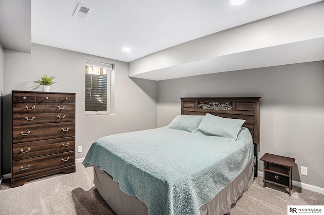 carpeted bedroom featuring baseboards and recessed lighting