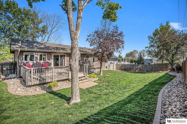 view of yard with a deck