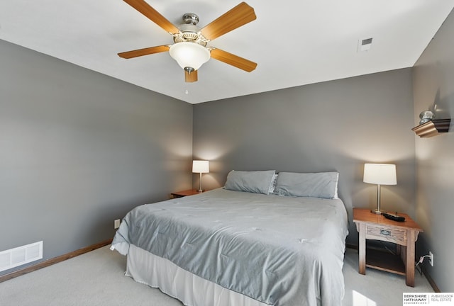 bedroom featuring carpet, baseboards, and a ceiling fan