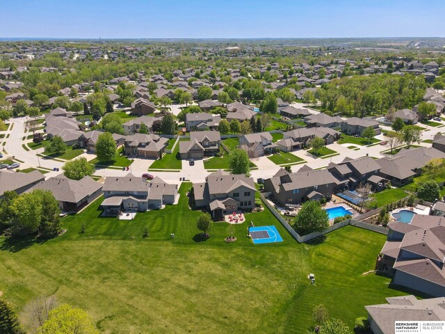 aerial view of residential area featuring a pool area