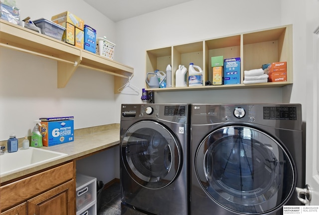 laundry area with washer and dryer and cabinet space