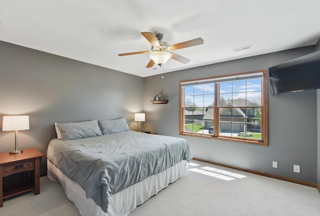 bedroom with carpet floors, baseboards, and a ceiling fan
