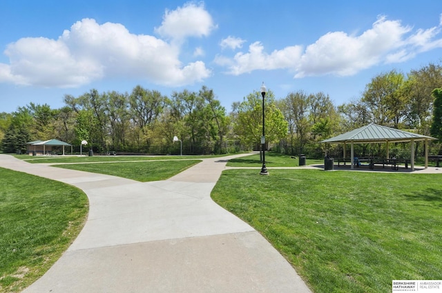 view of property's community with a gazebo and a lawn