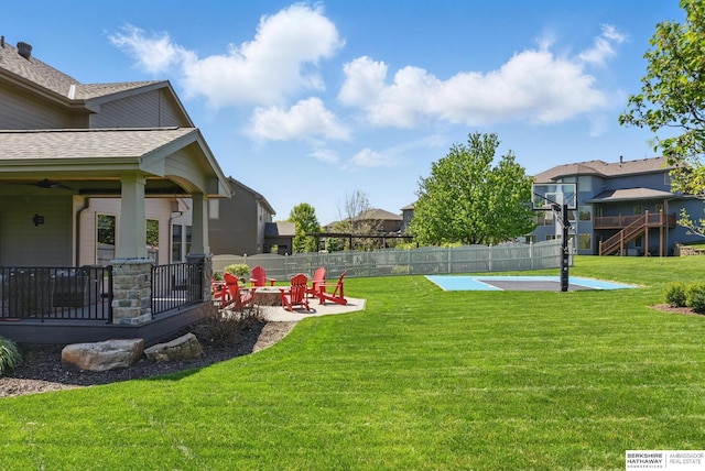 view of yard featuring a patio and an outdoor fire pit
