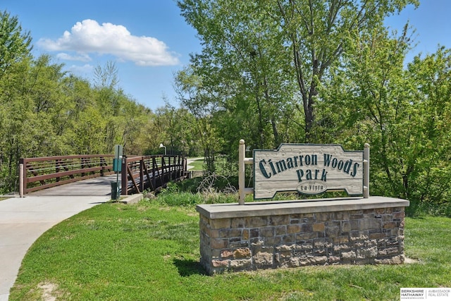community sign featuring a lawn