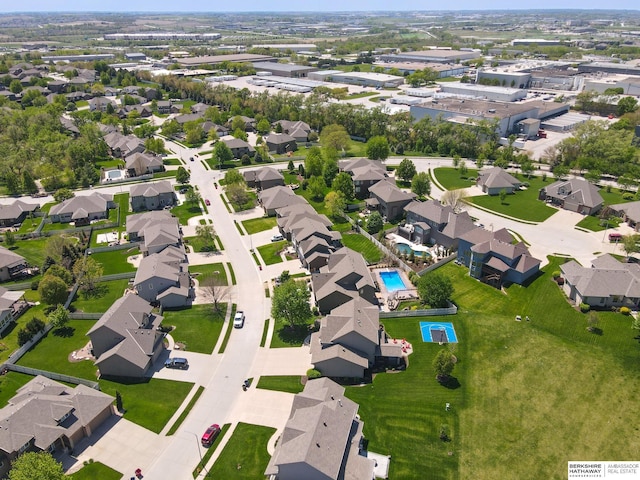aerial view of property's location featuring nearby suburban area and a pool