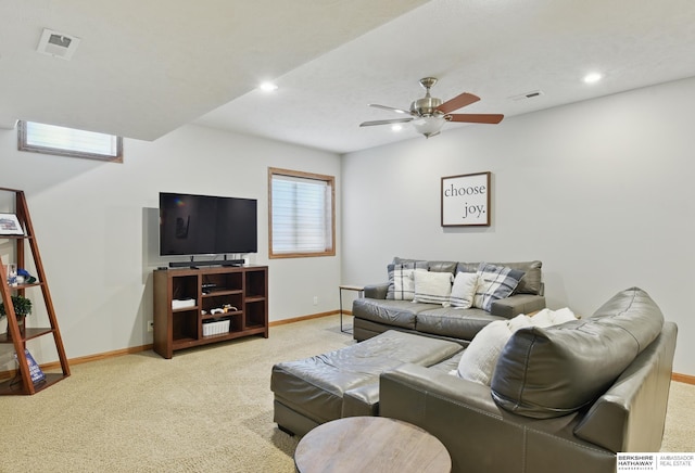 living area featuring carpet flooring, baseboards, ceiling fan, and recessed lighting