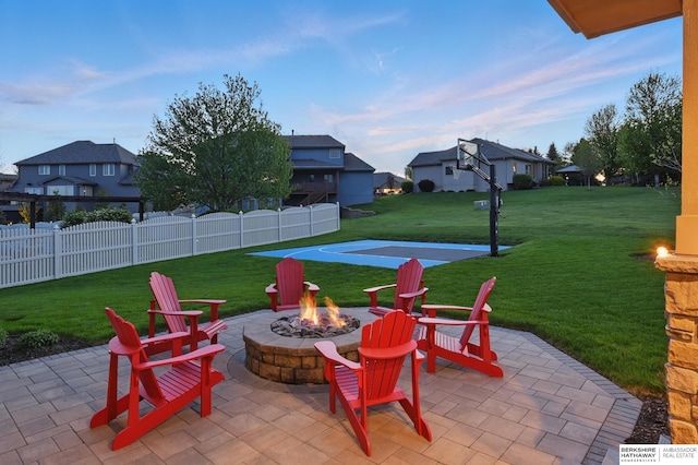 view of patio featuring a fire pit and a residential view