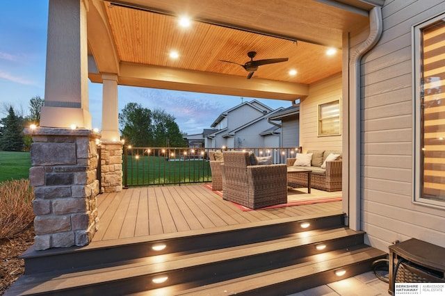 wooden terrace featuring a ceiling fan and outdoor lounge area