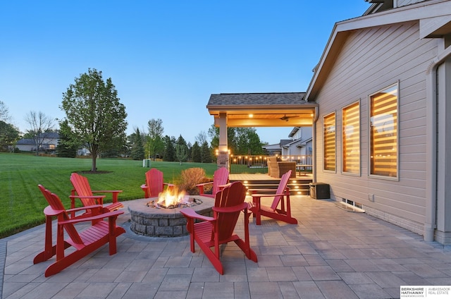 view of patio / terrace with an outdoor fire pit and a wooden deck