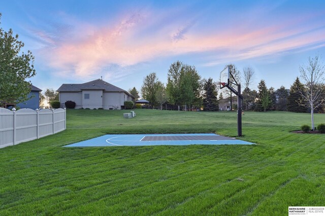view of sport court with basketball hoop