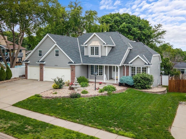 3120 Browning St, Lincoln, NE 68516 - traditional-style home with a porch, concrete driveway, a garage, and brick siding