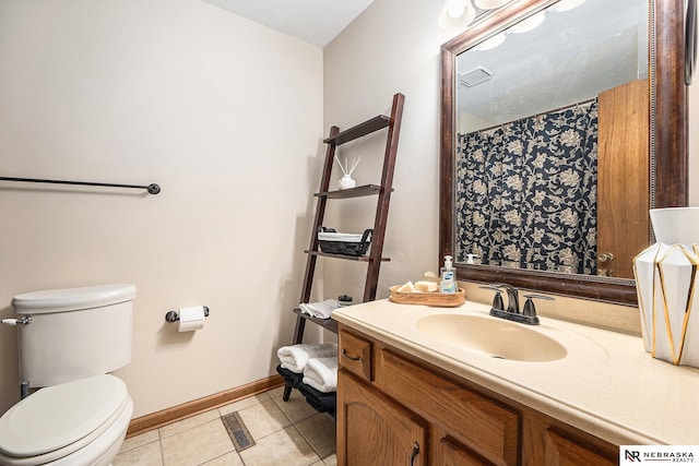 14523 Parker St, Omaha, NE 68154 - full bath with tile patterned flooring, baseboards, toilet, and vanity