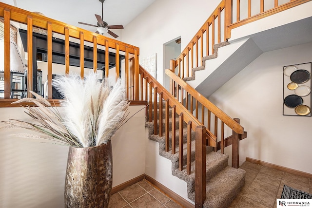 14523 Parker St, Omaha, NE 68154 - staircase with ceiling fan, baseboards, and tile patterned floors