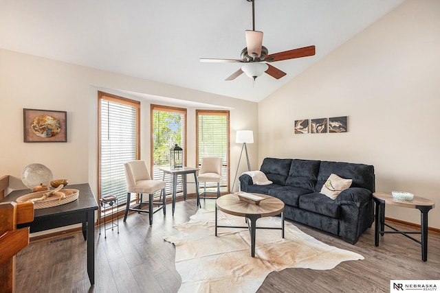 14523 Parker St, Omaha, NE 68154 - living room with a ceiling fan, vaulted ceiling, light wood finished floors, and baseboards