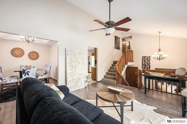 14523 Parker St, Omaha, NE 68154 - living room with a chandelier, stairway, light wood-style flooring, a ceiling fan, and high vaulted ceiling