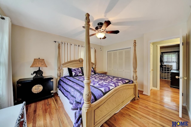 bedroom featuring a closet, light wood-type flooring, ceiling fan, and baseboards