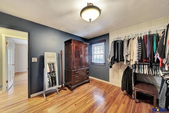 spacious closet with light wood finished floors