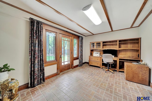 office with baseboards, brick patterned flooring, and built in study area