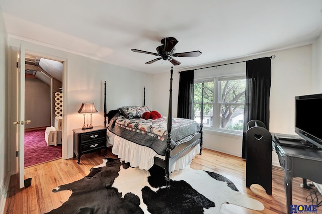 bedroom with wood finished floors, ceiling fan, and baseboards