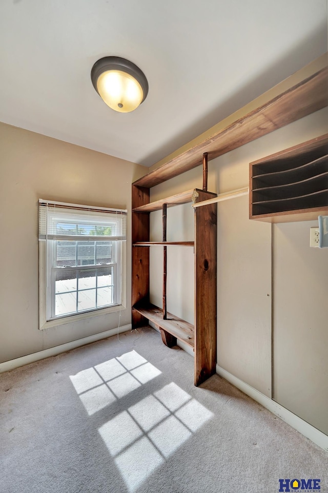 unfurnished bedroom with carpet and baseboards