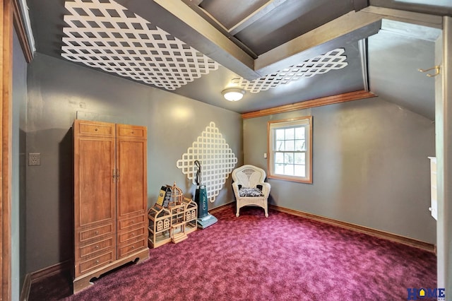 living area featuring carpet flooring, baseboards, and vaulted ceiling
