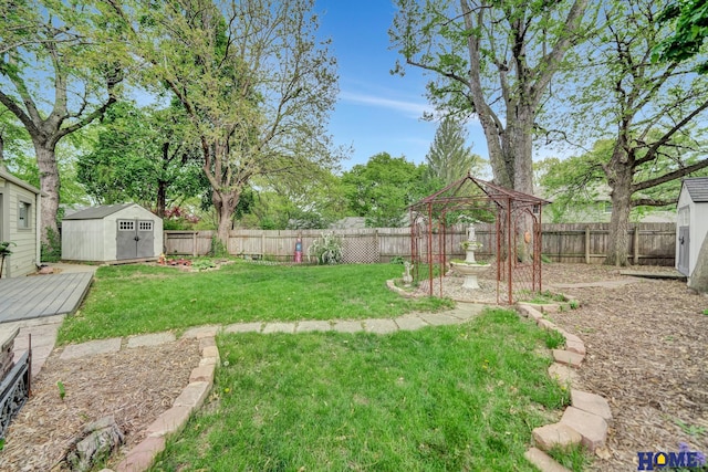 view of yard featuring a storage unit, an outdoor structure, and a gazebo