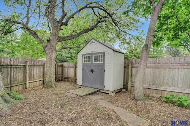 view of shed featuring a fenced backyard