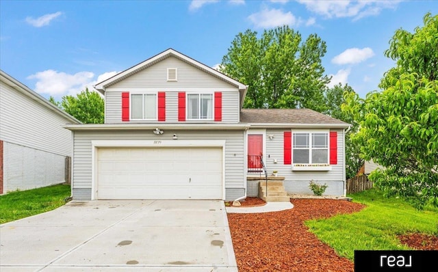 11019 Weber St, Omaha, NE 68142 - split level home featuring concrete driveway and an attached garage