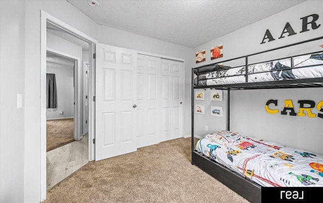 11019 Weber St, Omaha, NE 68142 - carpeted bedroom featuring a closet and a textured ceiling