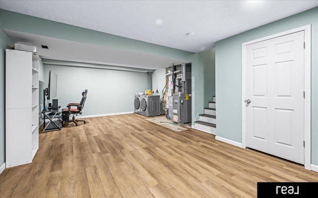11019 Weber St, Omaha, NE 68142 - below grade area with washer and clothes dryer, wood finished floors, stairs, baseboards, and an office area