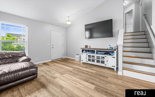 11019 Weber St, Omaha, NE 68142 - living room featuring wood finished floors, stairs, lofted ceiling, and baseboards