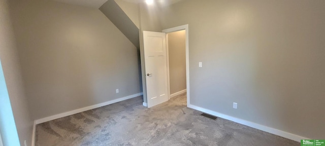 1321 N Main St, Henderson, NE 68371 - unfurnished bedroom with carpet flooring, baseboards, and vaulted ceiling