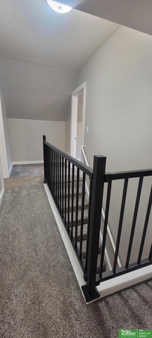 1321 N Main St, Henderson, NE 68371 - stairs with carpet flooring, vaulted ceiling, and baseboards
