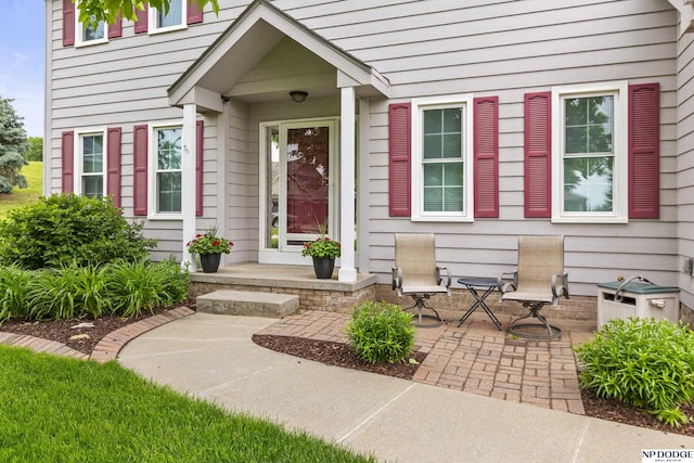 property entrance featuring a patio area