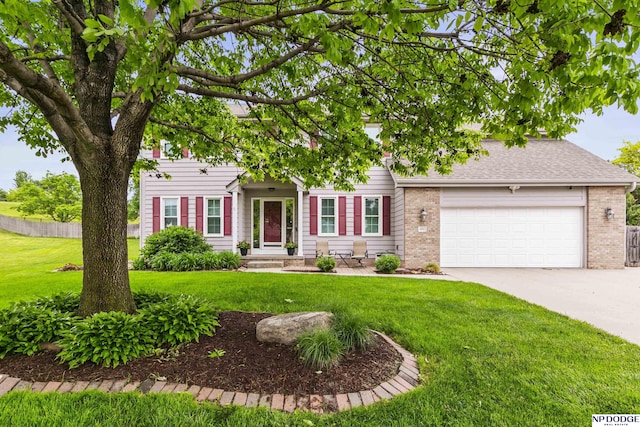 view of front of house featuring concrete driveway, brick siding, an attached garage, and a front lawn