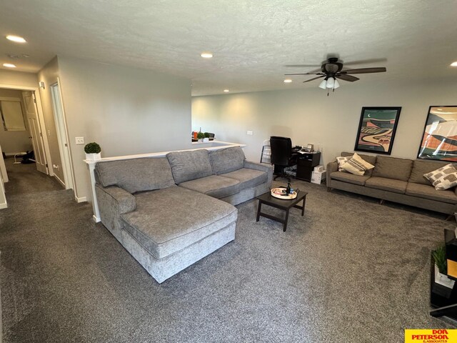 3545 Little Bluestem Rd, Fremont, NE 68025 - living area with dark colored carpet, recessed lighting, a ceiling fan, a textured ceiling, and a desk