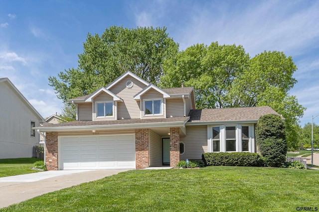 view of front facade featuring concrete driveway, a front yard, and brick siding