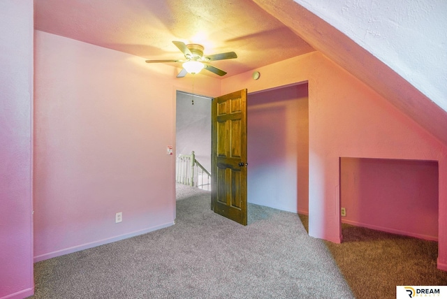 bonus room featuring carpet and ceiling fan
