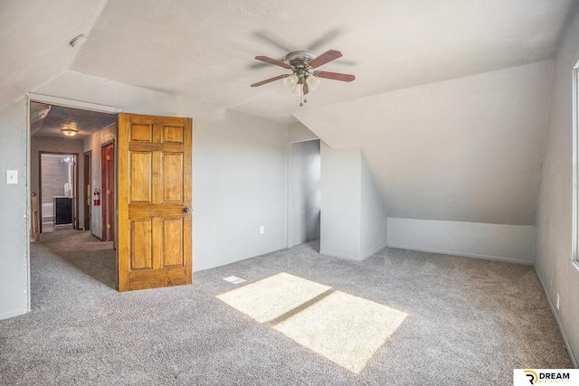 bonus room with carpet, ceiling fan, and vaulted ceiling