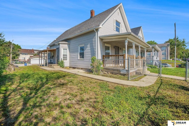 view of home's exterior featuring a porch, a chimney, a gate, and a shingled roof