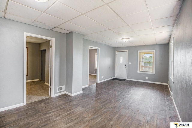 entryway with a drop ceiling, dark wood-style floors, and baseboards