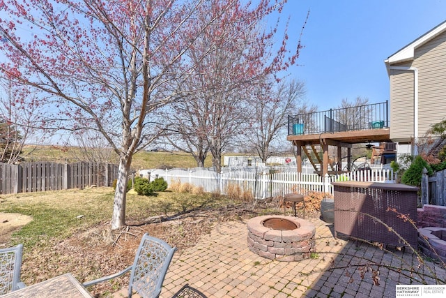 8114 S 167th St, Omaha, NE 68136 - fenced backyard featuring an outdoor fire pit and a patio