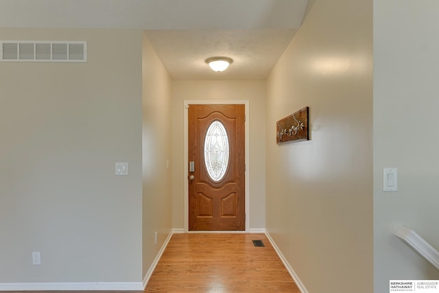 8114 S 167th St, Omaha, NE 68136 - doorway with light wood-style flooring and baseboards